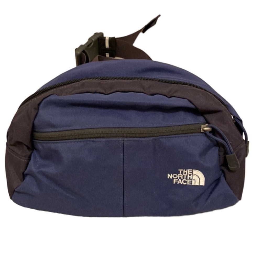 The North Face navy and black belt bag .